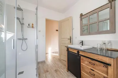 a bathroom with a sink and a shower at Mas Seraphin in LʼIsle-sur-la-Sorgue
