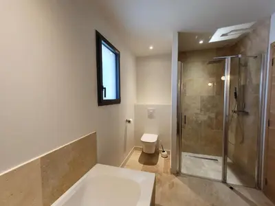 a bathroom with a shower and a toilet and a sink at L'Instant Luberon in Gordes