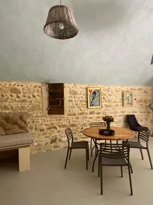 a dining room with a table and chairs at Eden - Mas de Rousseau in Eyragues