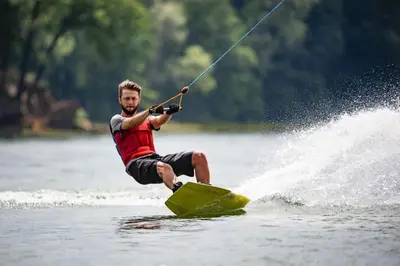 a man on a board in the water at Magnifique studio indépendant 35m2 proche du lac et au coeur du village in Peyrolles-en-Provence