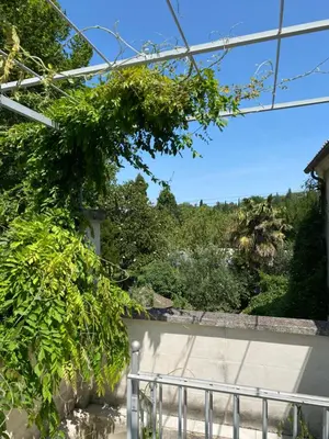 a view of a garden from inside a house at Cécile - Mas de Rousseau in Eyragues