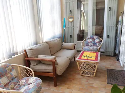 a living room with a couch and two chairs at Lumière de Provence in Mollégès