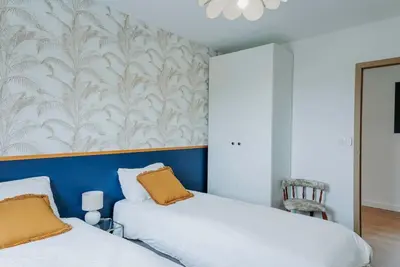 two beds sitting next to each other in a bedroom at Maison en Provence avec piscine in Éguilles