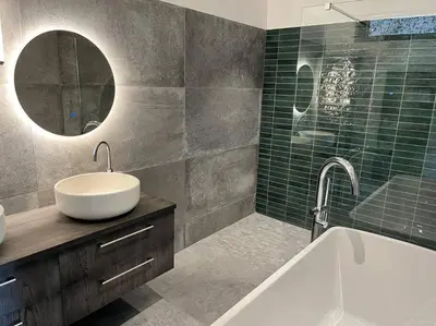 a bathroom with a sink and a tub and a mirror at Villa de charme in Châteauneuf-de-Gadagne