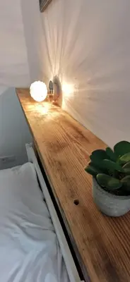 a bedroom with a table with a plant on it at La Petite Reine Du Ventoux in Sault-de-Vaucluse