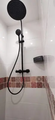 a shower in the corner of a room at La Petite Reine Du Ventoux in Sault-de-Vaucluse