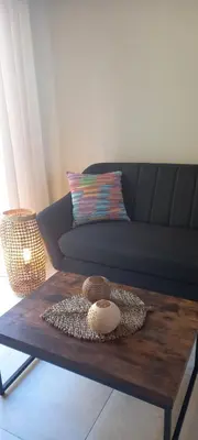 a coffee table in a living room with a couch at La Pifote in Villes-sur-Auzon
