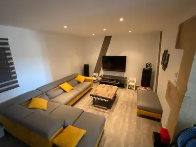 a living room with a couch and a tv at Villa individuelle avec piscine privée proche du Ventoux in Blauvac