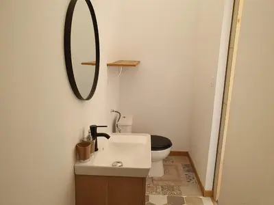 a bathroom with a sink and a toilet at Pura vida in Mazan