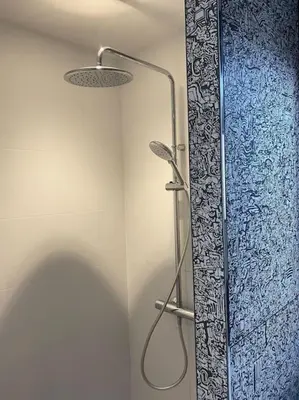 a shower in a bathroom with a glass door at Maison avec ses 2 terrasses et sa piscine in Eyragues