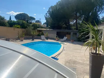 a pool in the backyard of a house at Beau Ciel in Châteauneuf-de-Gadagne