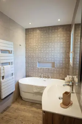a white bathroom with a tub and a sink at Villa Cocoon Lourmarin in Lourmarin