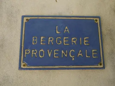 a blue sign on the side of a building at La Bergerie Provencale - Luberon - Provence - villa with heated pool in Roussillon