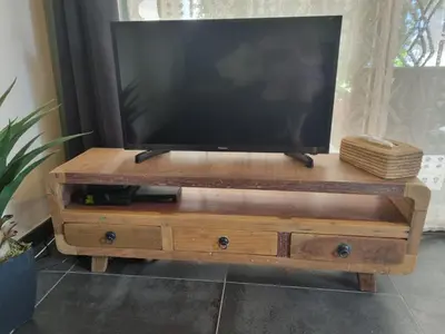a flat screen tv on a wooden tv stand at Ma Charmante Maison En Provence in Lançon-Provence