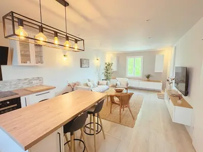 a kitchen and living room with a table and chairs at ''' Impasse d'un Instant ''' 8min Aix - Clim & Parking in Venelles