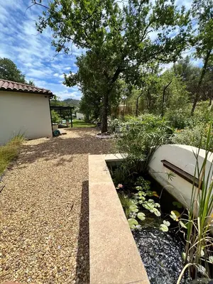 a bench sitting in a garden with a tree at Luxury Villa with Pool en Provence in Le Puy-Sainte-Réparade