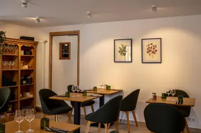 a dining room with two tables and chairs at L’auberge de Montsalier in Montsalier