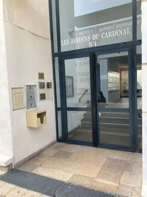 a glass door of a building with a sign on it at Le Forbin by La Familia in Aix-en-Provence