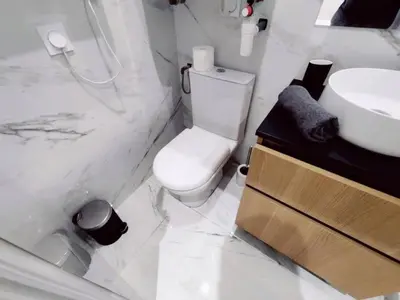 a white bathroom with a toilet and a sink at Le Boulegon by La Familia in Aix-en-Provence