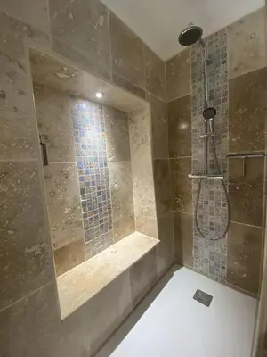 a bathroom with a shower with a glass window at Chambre d'hôtes Alizé, Le Moulin de Prédelles in Reillanne