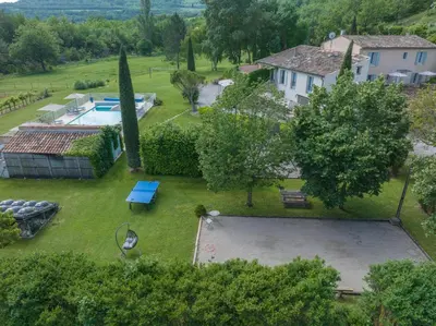 an aerial view of a yard with a swimming pool at Chambre d'hôtes Alizé, Le Moulin de Prédelles in Reillanne