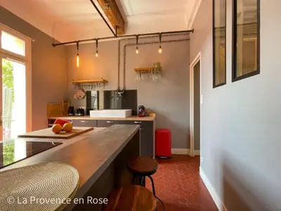 a kitchen with a large counter in a room at Charmant appartement T2 / 58 m2 / 4 personnes in Aix-en-Provence