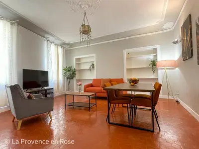 a living room with a couch and a table at Charmant appartement T2 / 58 m2 / 4 personnes in Aix-en-Provence