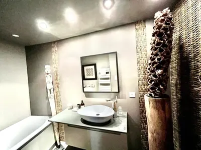 a bathroom with a sink and a bath tub at Maison en pierre avec piscine, 6 couchages, située au cœur de Mallemort, Provence. - FR-1-658-25 in Mallemort