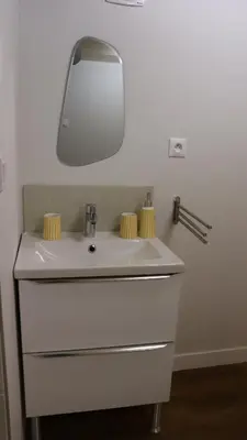 a bathroom with a white sink with a mirror at Studio rénové maison de village du Luberon in Villelaure