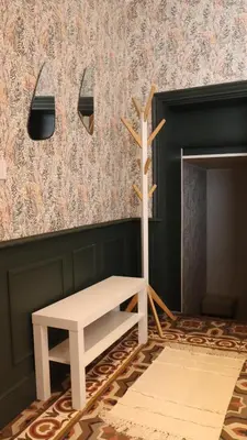 a white bench sitting in a room with a wall at Studio rénové maison de village du Luberon in Villelaure