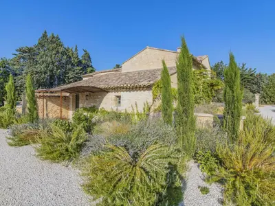 a house with trees and plants in the yard at Holiday Home Le Mas de Marius by Interhome in Cavaillon