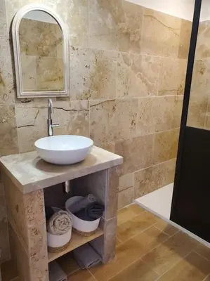a bathroom with a sink and a mirror at Rêve en Lubéron in Lauris