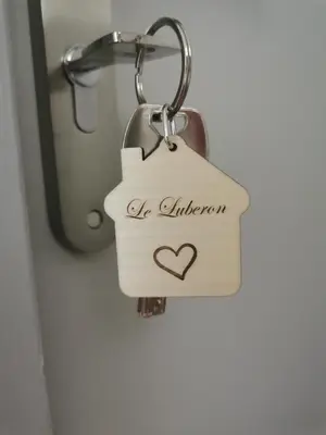 a wooden tag with a heart on it hanging on a door at LA GRANGETTE in Velleron