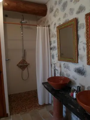 a bathroom with two sinks and a shower at Pavillon de Beauregard in Aix-en-Provence