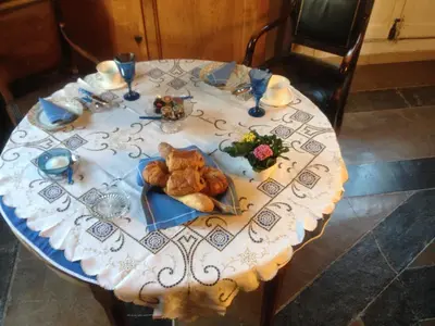 a table with a plate of food on it at Pavillon de Beauregard in Aix-en-Provence