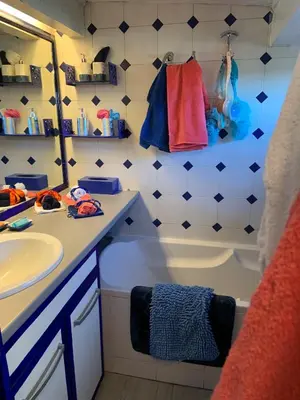 a bathroom with a sink and a tub and a mirror at Appartement de Luxe ,