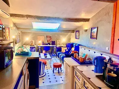 a kitchen with blue chairs and a counter top at Appartement de Luxe ,
