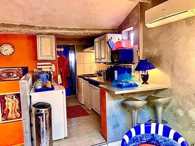 a kitchen with a counter and a stove top oven at Appartement de Luxe ,