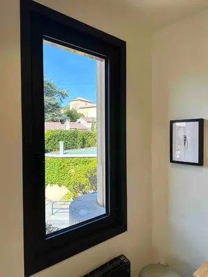 a window in a room with a view of a yard at Centre ville AIX - Terrasse / Ascenseur - Rénové in Aix-en-Provence