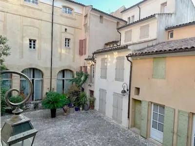 an empty courtyard in a city with buildings at LUXURY Enchanting Duplex Aix Center in Aix-en-Provence