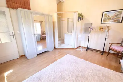 a living room with a large doorway and a mirror at mas attached to another building with private pool 4 people in carpentras, at the foot of the ventoux in provence. in Carpentras