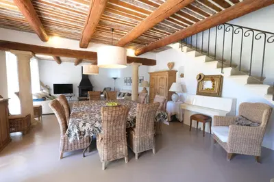 a dining room with a table and chairs at magnificient property with heated swimming-pool in the luberon - 14 persons in Les Taillades