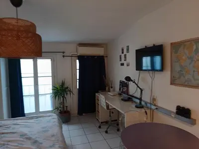 a room with a desk and a computer in it at Studio cathédrale centre Aix-en-Provence in Aix-en-Provence