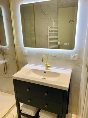 a bathroom with a sink and a mirror at Cigale de Gordes in Gordes