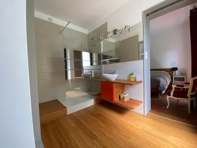 a bathroom with a sink and a mirror at Le mas de l'Auzon in Carpentras