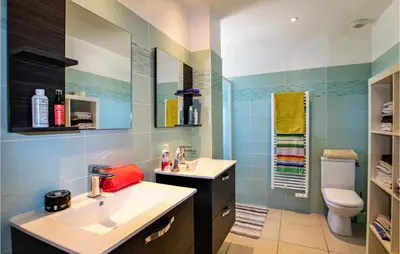 a bathroom with a sink and a toilet at Gorgeous Home In Aubignan in Aubignan