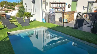 a backyard with a swimming pool with green grass at Villa Provence Baraka centre-ville in Salon-de-Provence