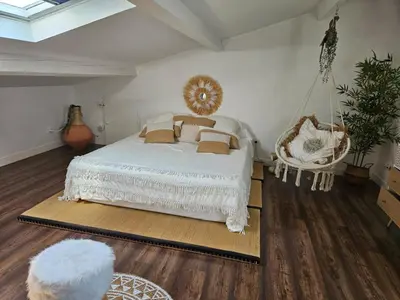 a bedroom with a white bed and a swing at Villa Provence Baraka centre-ville in Salon-de-Provence