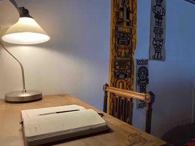 a printer sitting on a desk next to a lamp at Le Cardinale - Un Voyage en Provence - 2 chambres avec parking in Aix-en-Provence