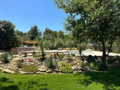 a group of chairs sitting around a circular table at Villa Piscine Vue exceptionnelle in Murs